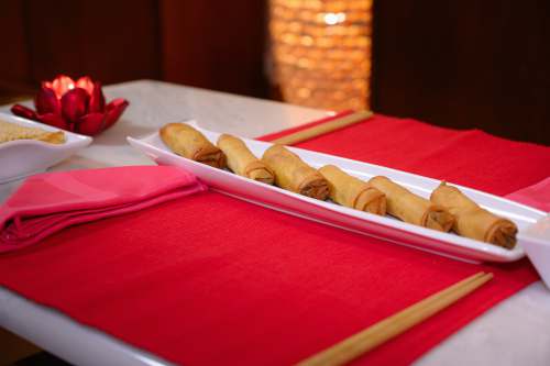 red homeware brown bread on red textile chopsticks